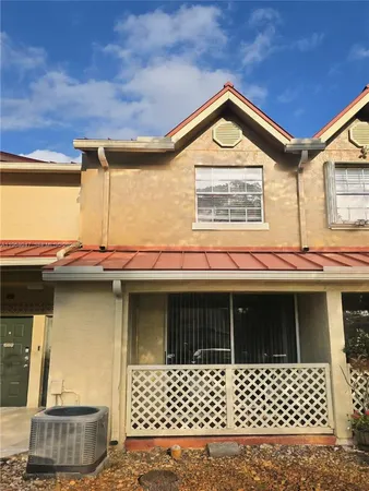a front view of a house with a garage