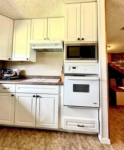a close view of sink and cabinets