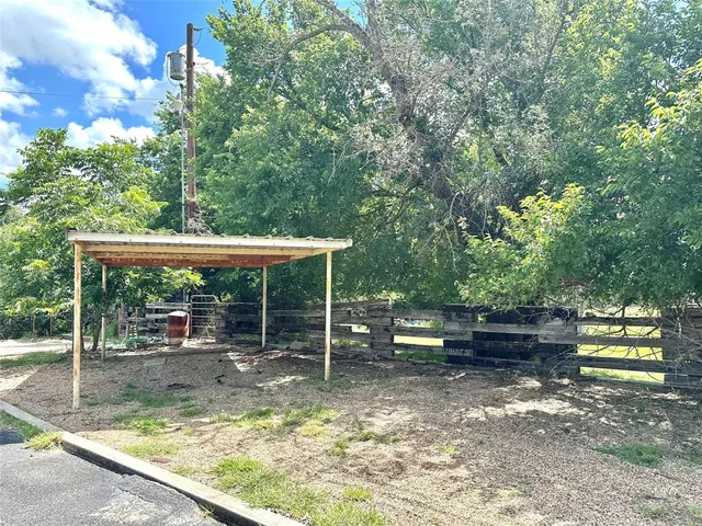 swimming pool view with a seating space