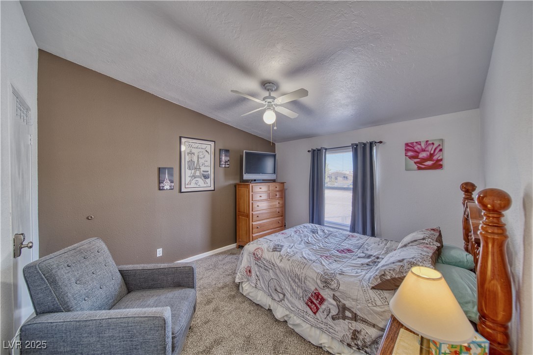 2891 Rio Rico Drive Pahrump, NV 89048 - Photo 16 of 45 Bedroom with ceiling fan and walk in closet