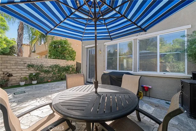 a view of a patio in the backyard