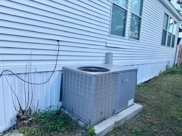 a view of a chairs and table in patio