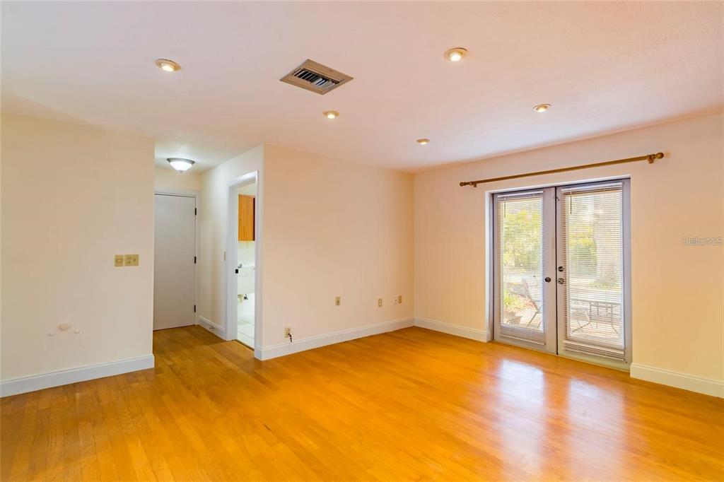 1647 Hobbit Road Dunedin, FL 34698 - Photo 20 of 36 a view of empty room with wooden floor