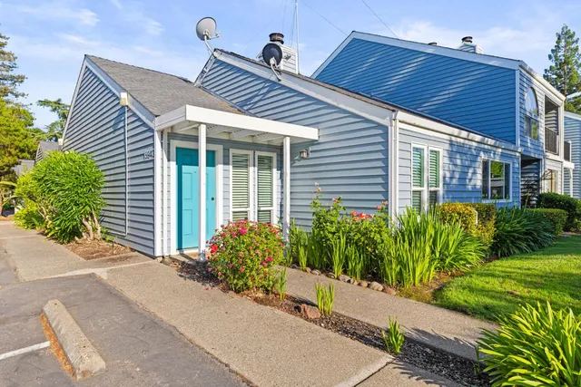 a front view of a house with garden