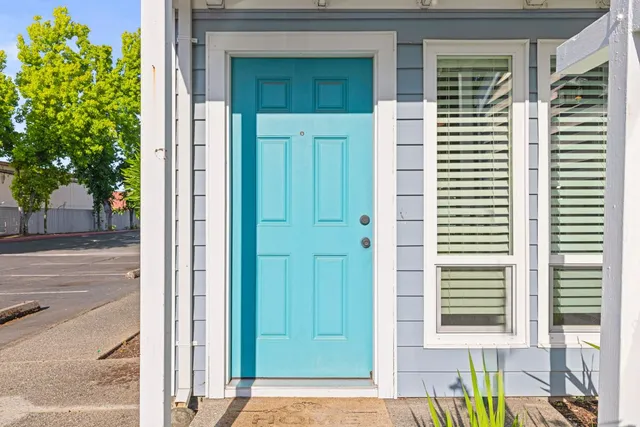 a view of a house with a yard and garage