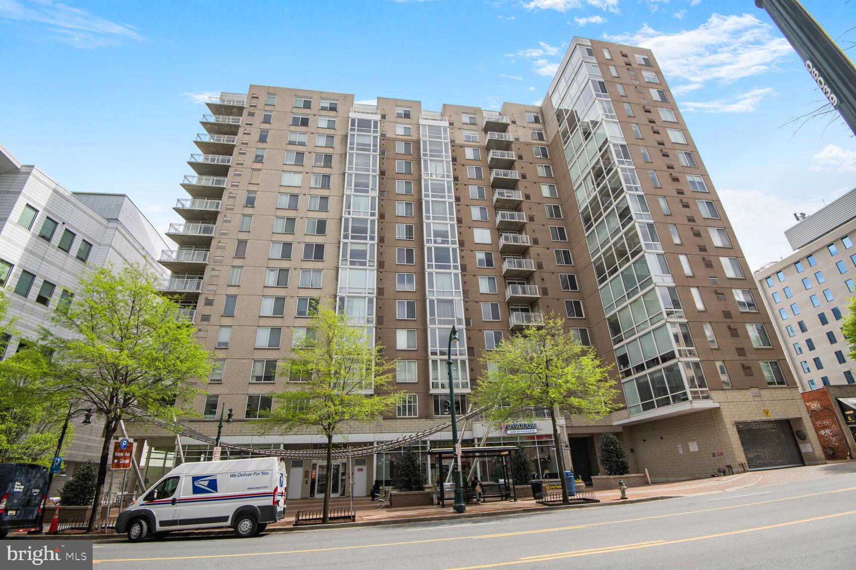 930 Wayne Avenue, Unit 1403 Silver Spring, MD 20910 - Photo 2 of 37 a view of a buildings and car parked on the roadside