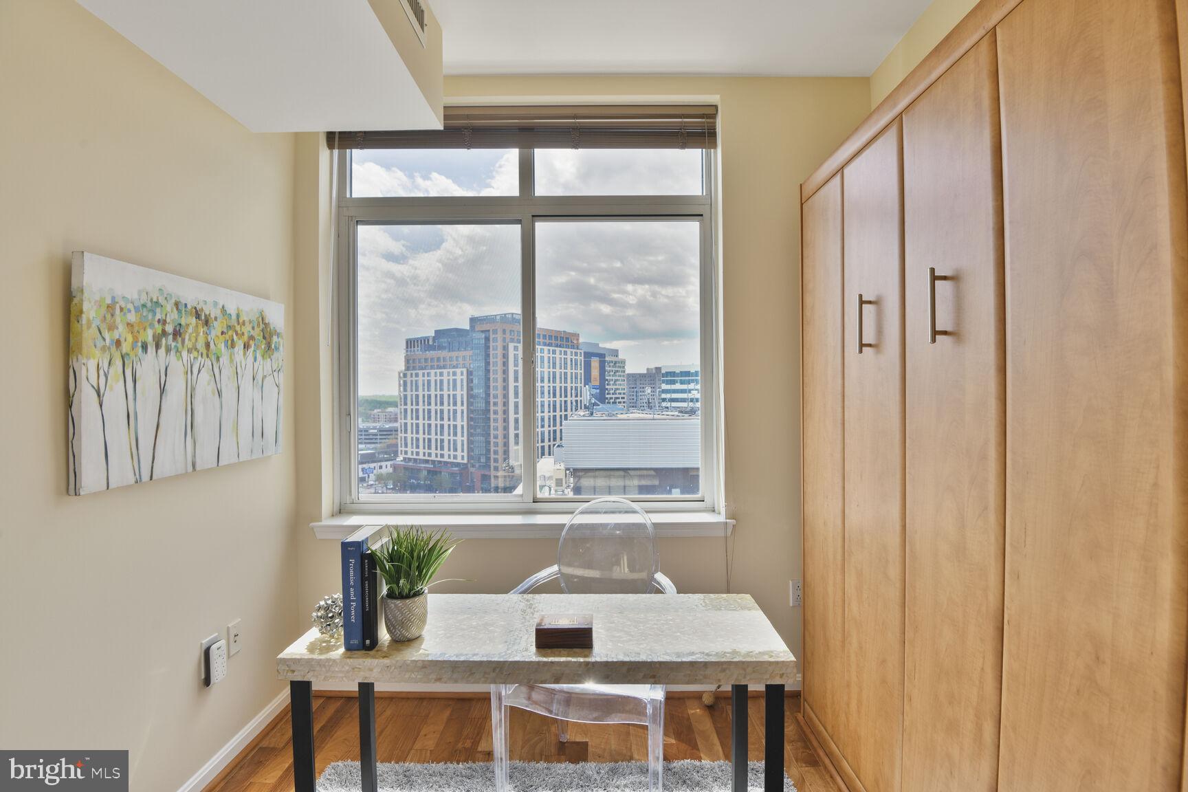 930 Wayne Avenue, Unit 1403 Silver Spring, MD 20910 - Photo 25 of 37 a view of a dining room with furniture window and outside view