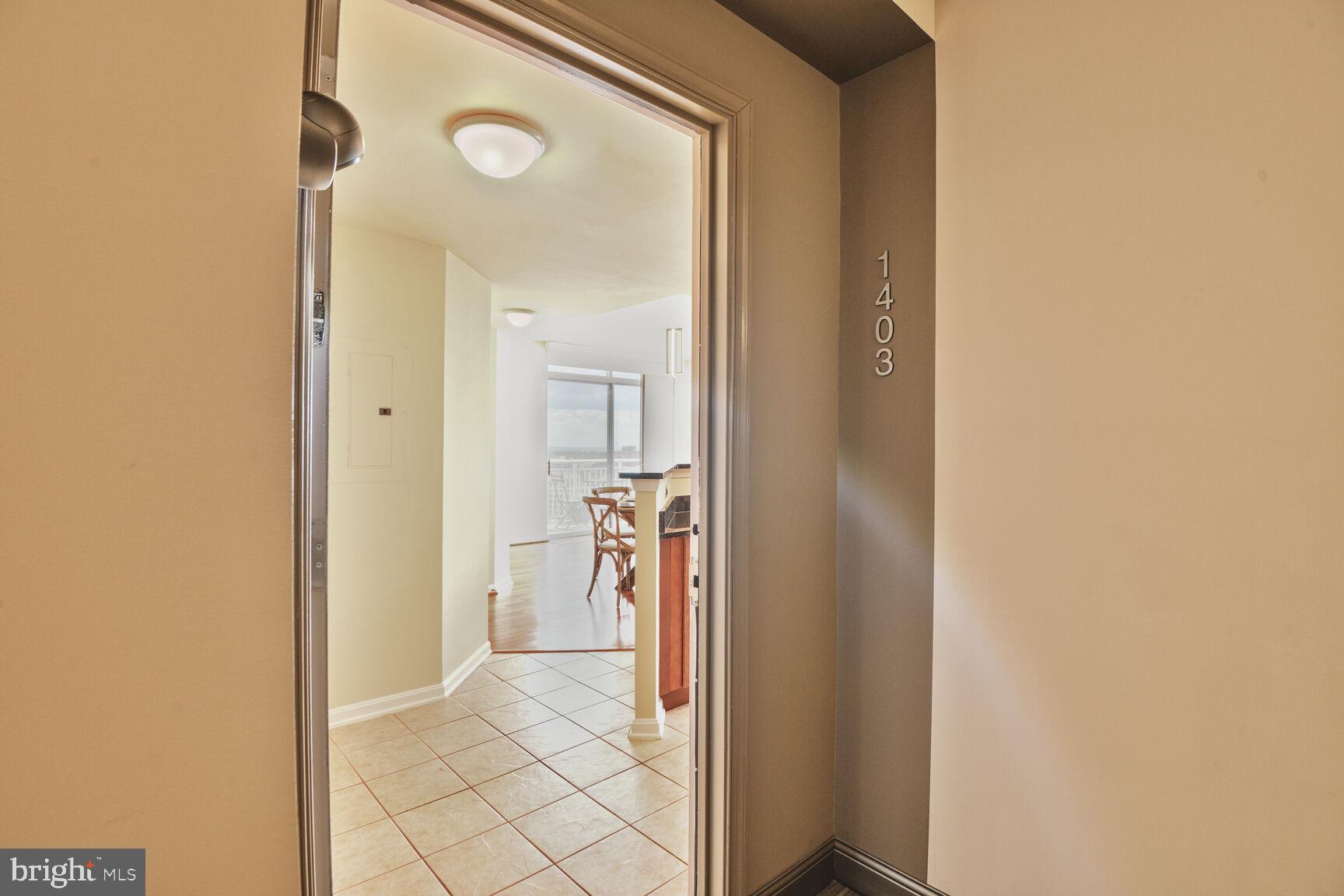 930 Wayne Avenue, Unit 1403 Silver Spring, MD 20910 - Photo 6 of 37 a view of a hallway with a living room