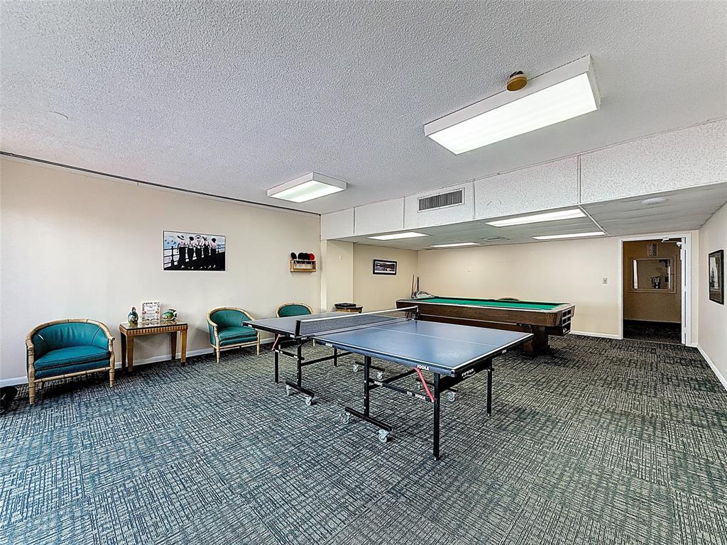 1147 Hillsboro Mile, Unit 506 Hillsboro Beach, FL 33062 - Photo 30 of 45 a room with furniture and a table