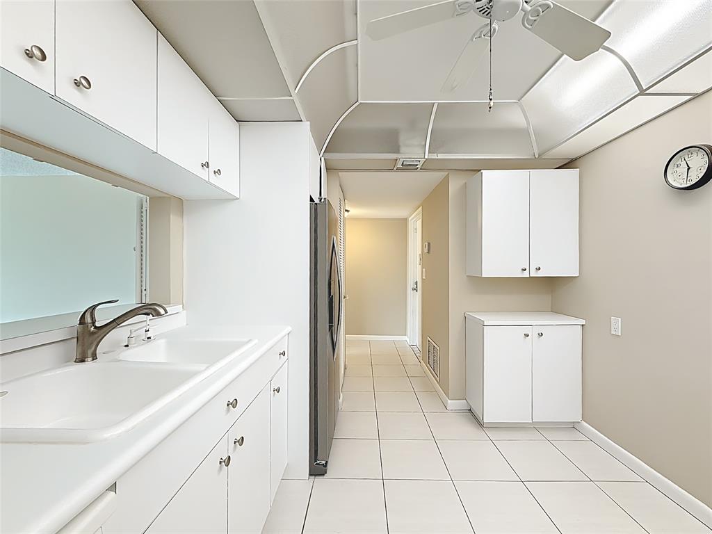 1147 Hillsboro Mile, Unit 506 Hillsboro Beach, FL 33062 - Photo 10 of 45 a spacious bathroom with a double vanity sink a mirror and a bathtub