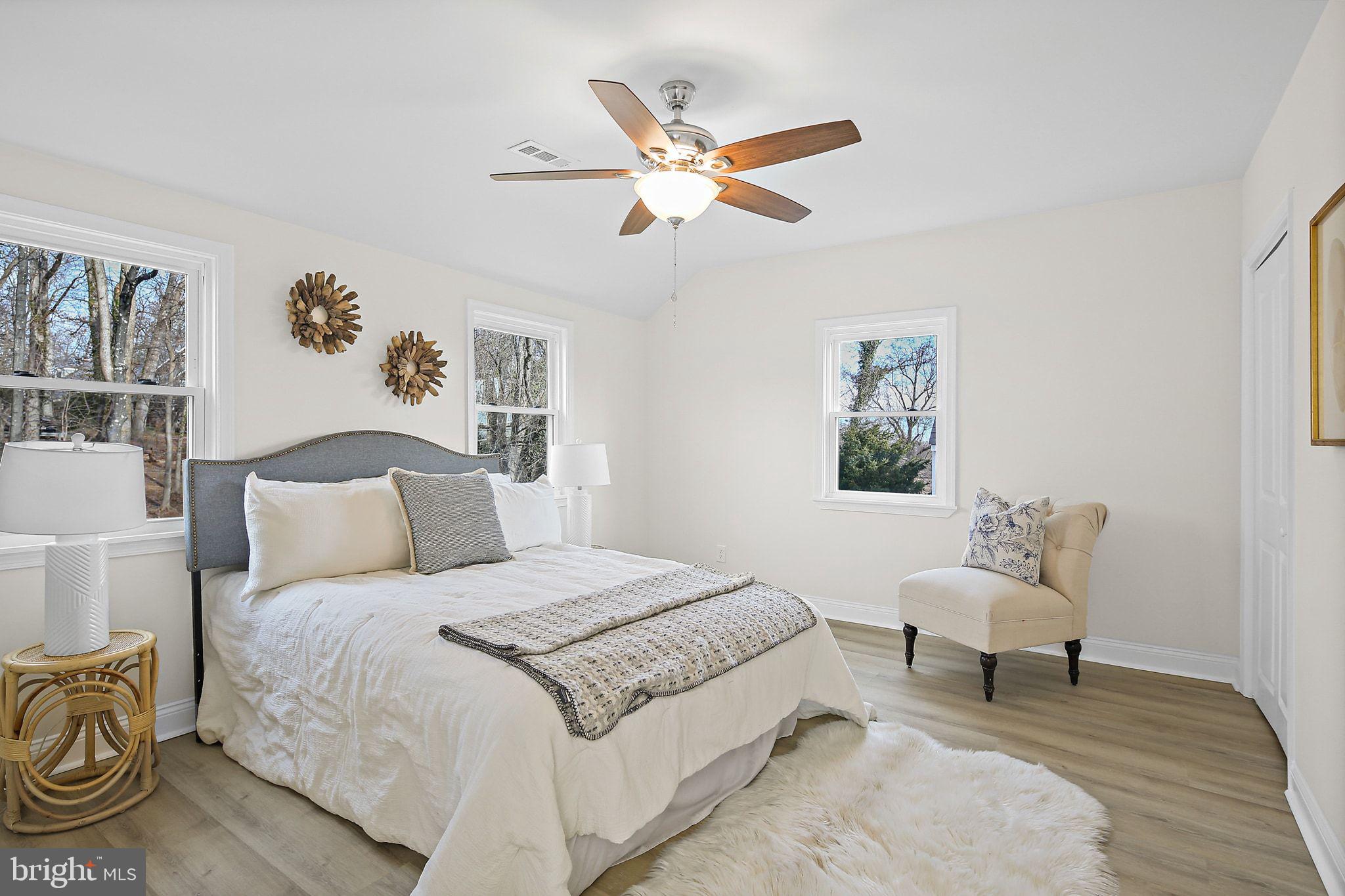 402 Westgate Road Baltimore, MD 21229 - Photo 17 of 34 a bedroom with a bed and a chandelier