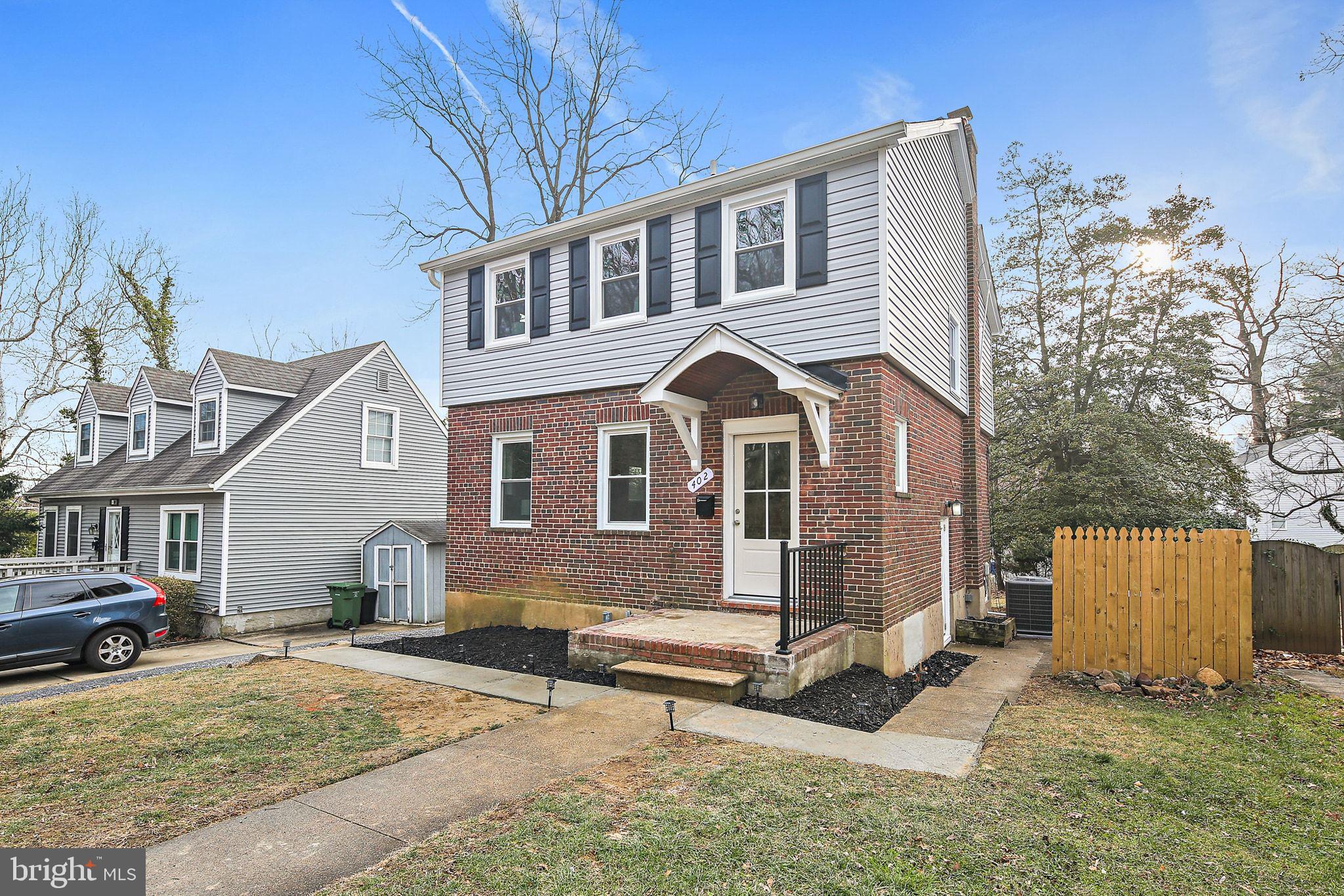 402 Westgate Road Baltimore, MD 21229 - Photo 2 of 34 a front view of a house with a yard