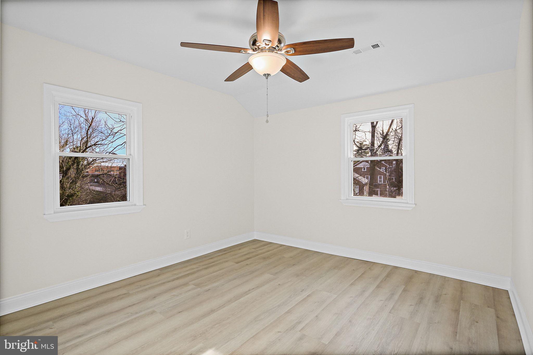 402 Westgate Road Baltimore, MD 21229 - Photo 21 of 34 a view of a ceiling fan with wooden floor
