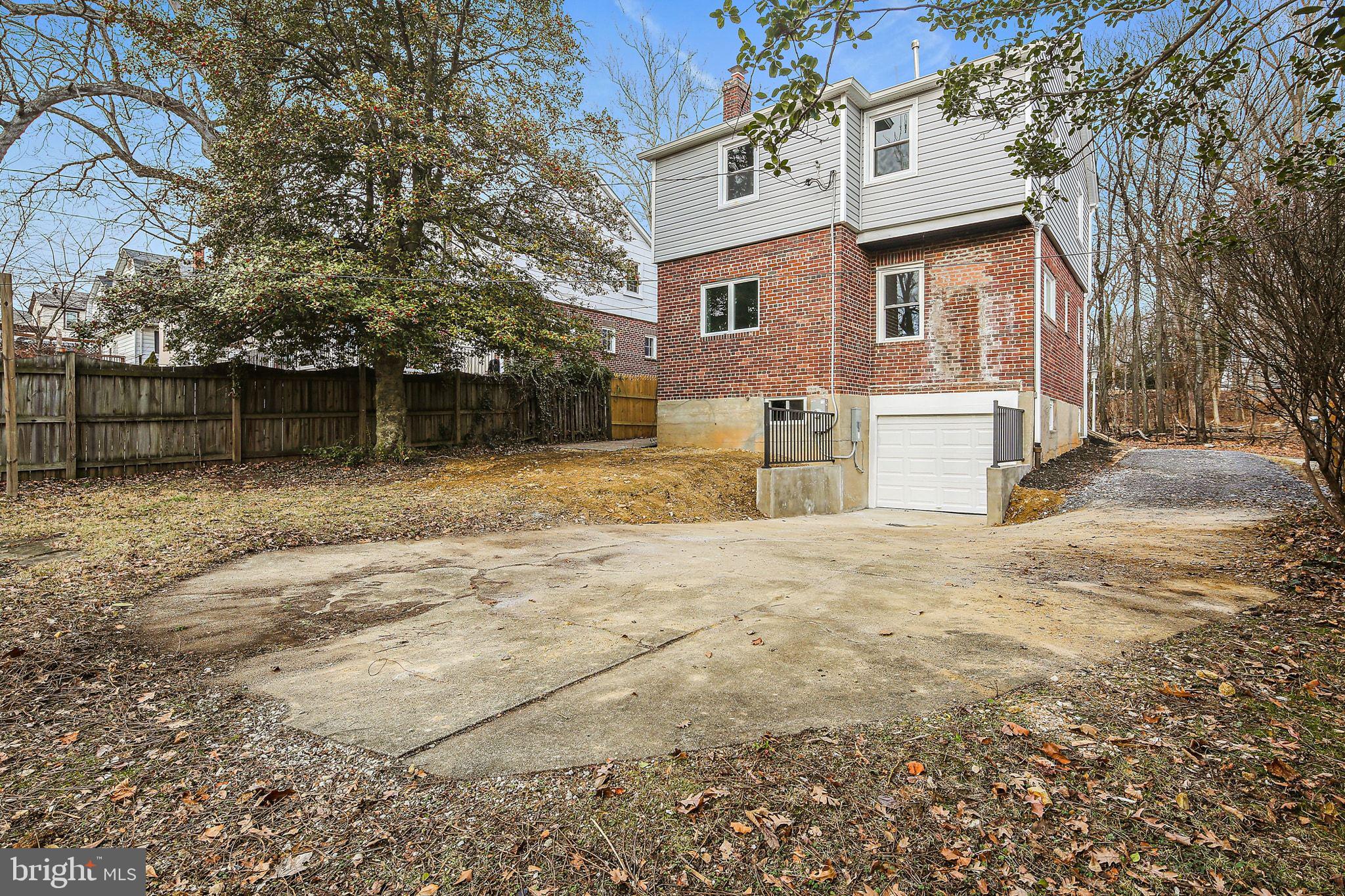 402 Westgate Road Baltimore, MD 21229 - Photo 31 of 34 front view of a house with a yard