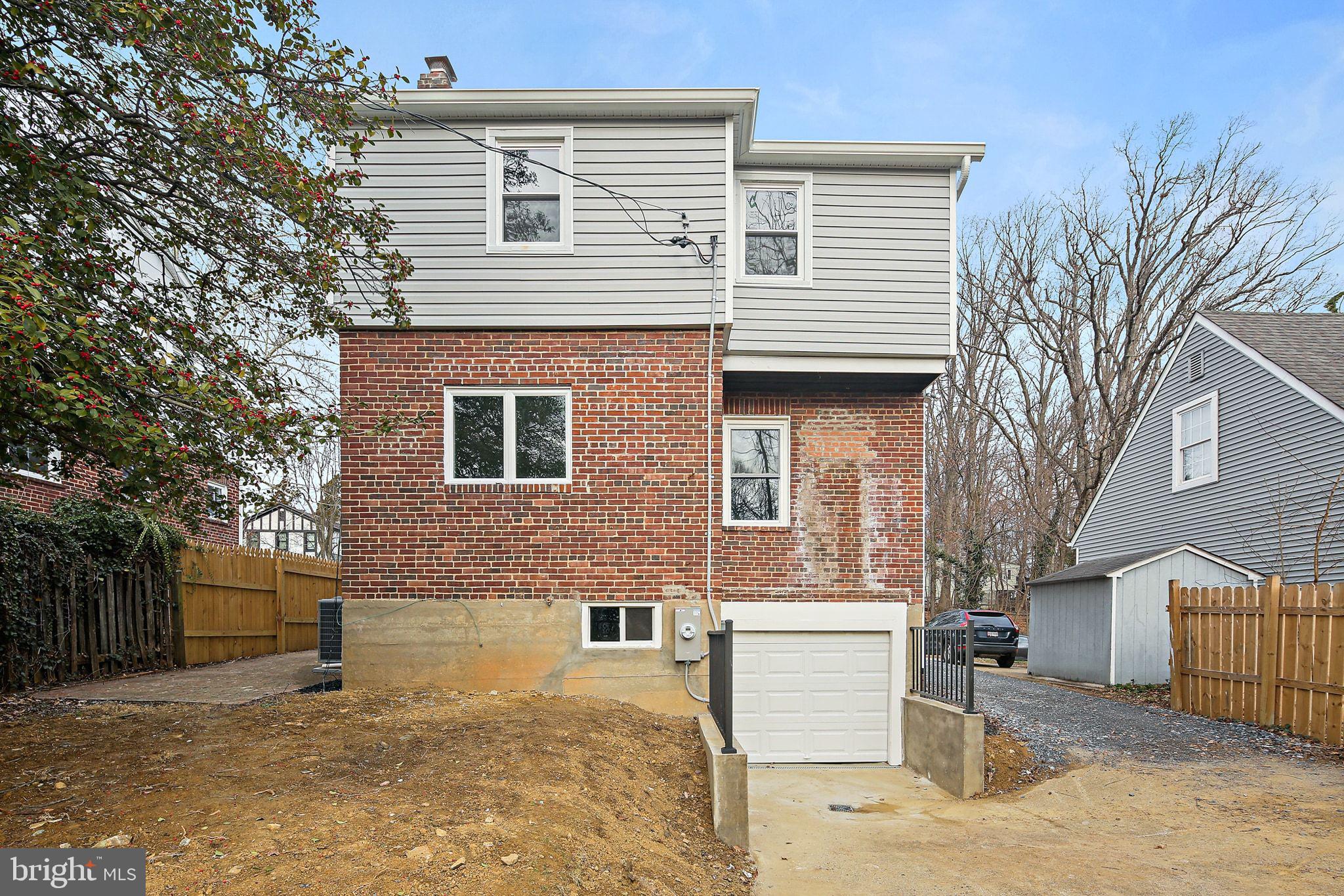 402 Westgate Road Baltimore, MD 21229 - Photo 32 of 34 a view of a house with a yard