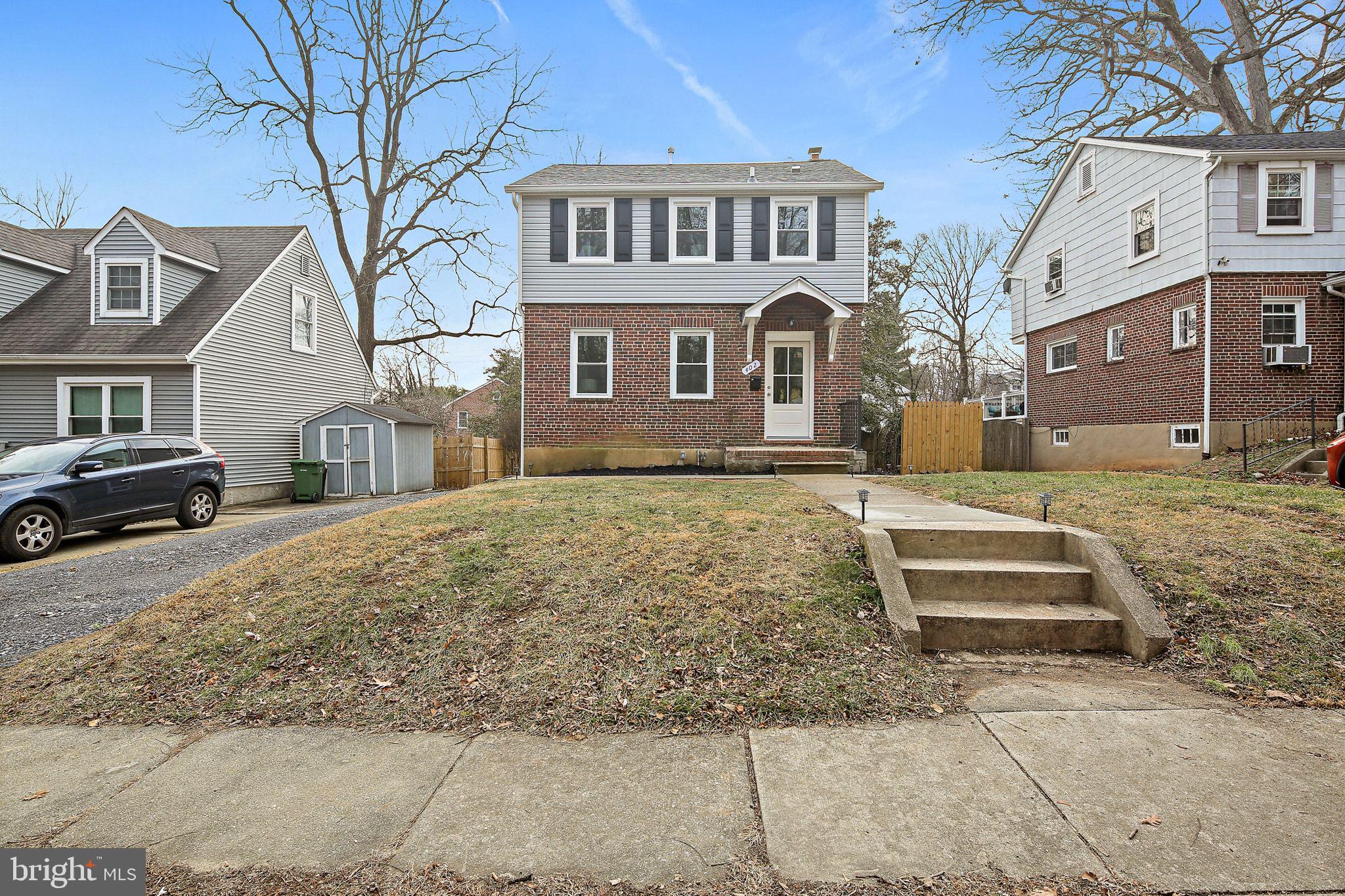 402 Westgate Road Baltimore, MD 21229 - Photo 4 of 34 a front view of a house with a yard