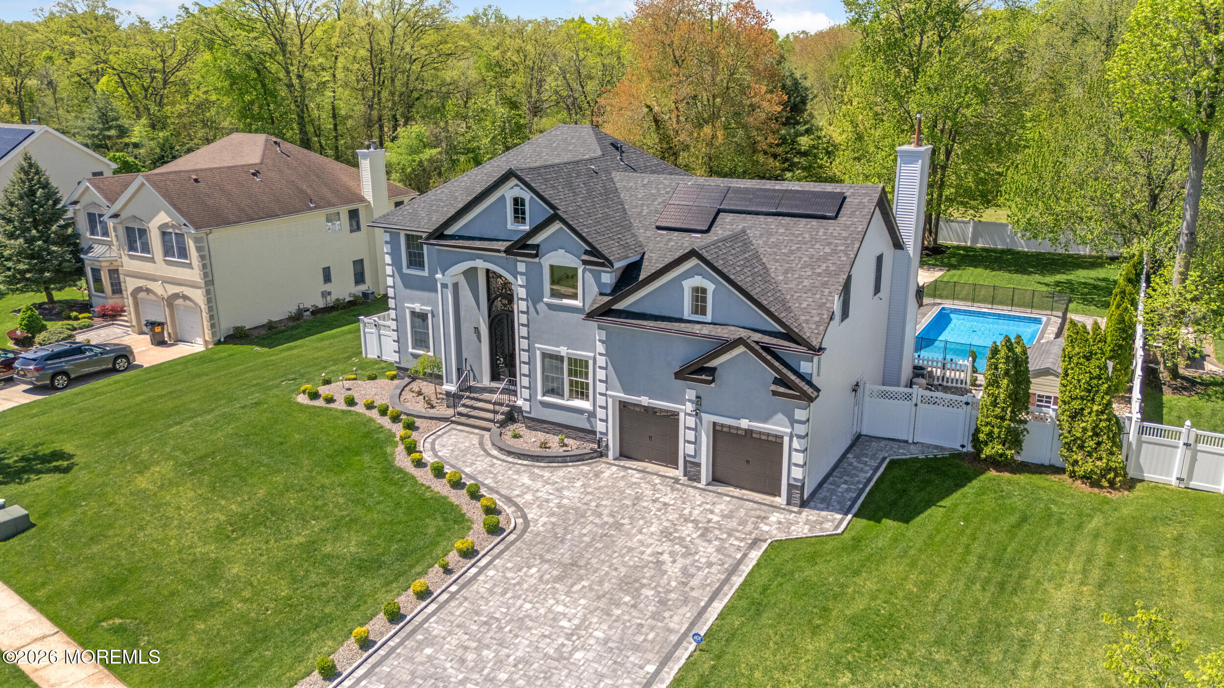 104 Autumn Road Matawan, NJ 07747 - Photo 58 of 64 a aerial view of a house next to a yard