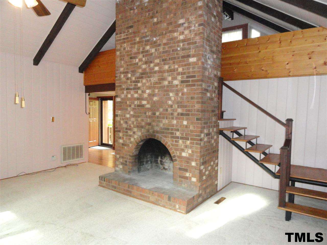 103 Oleander Road Carrboro, NC 27510 - Photo 3 of 16 Brick Fireplace adds charm to this living space