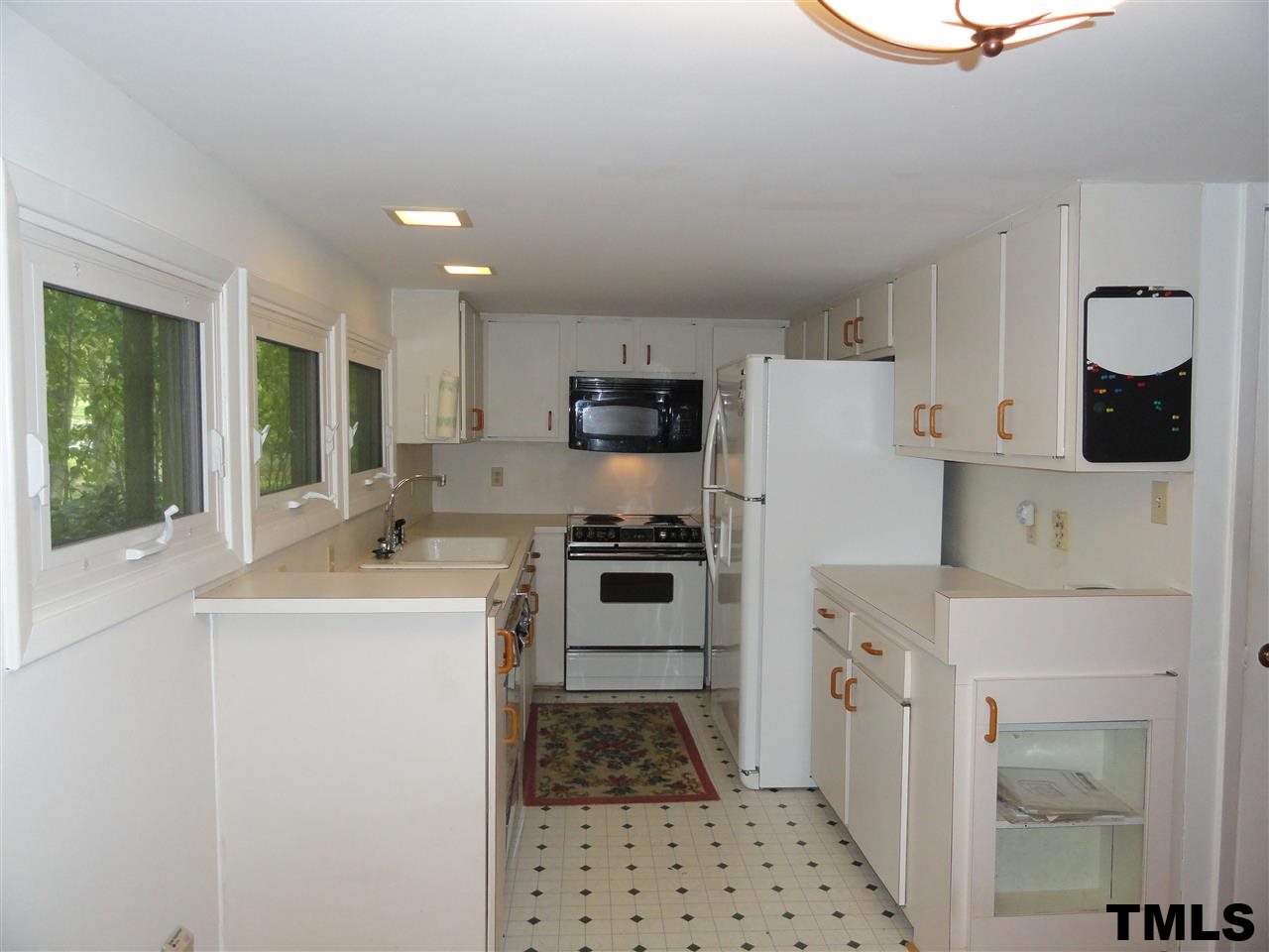 103 Oleander Road Carrboro, NC 27510 - Photo 6 of 16 The kitchen is adjacent to the Dining area