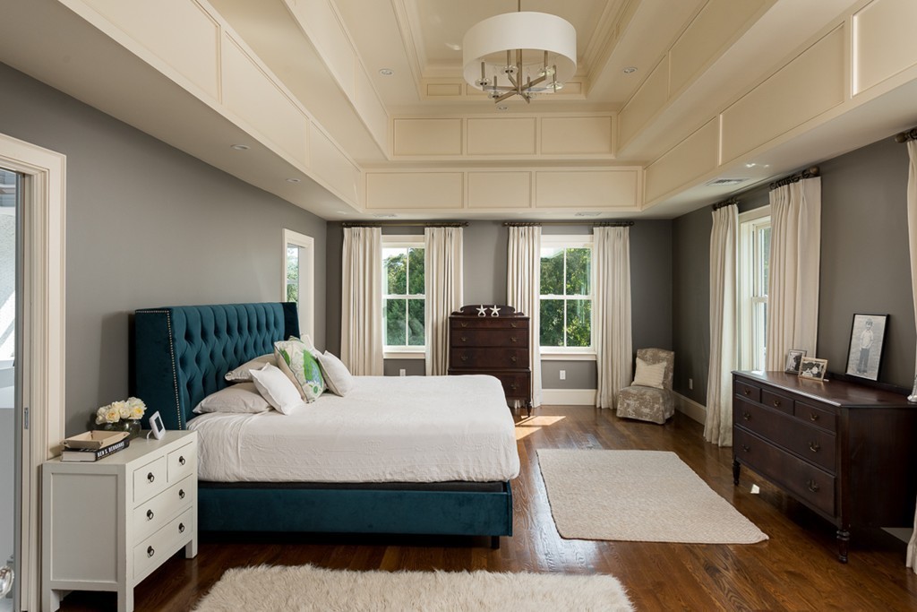 392 Main Street Hingham, MA 02043 - Photo 18 of 30 a bedroom with a bed and large windows