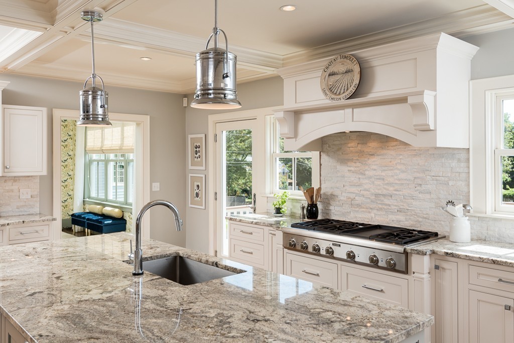 392 Main Street Hingham, MA 02043 - Photo 6 of 30 a kitchen with stainless steel appliances granite countertop a stove and a view of living room