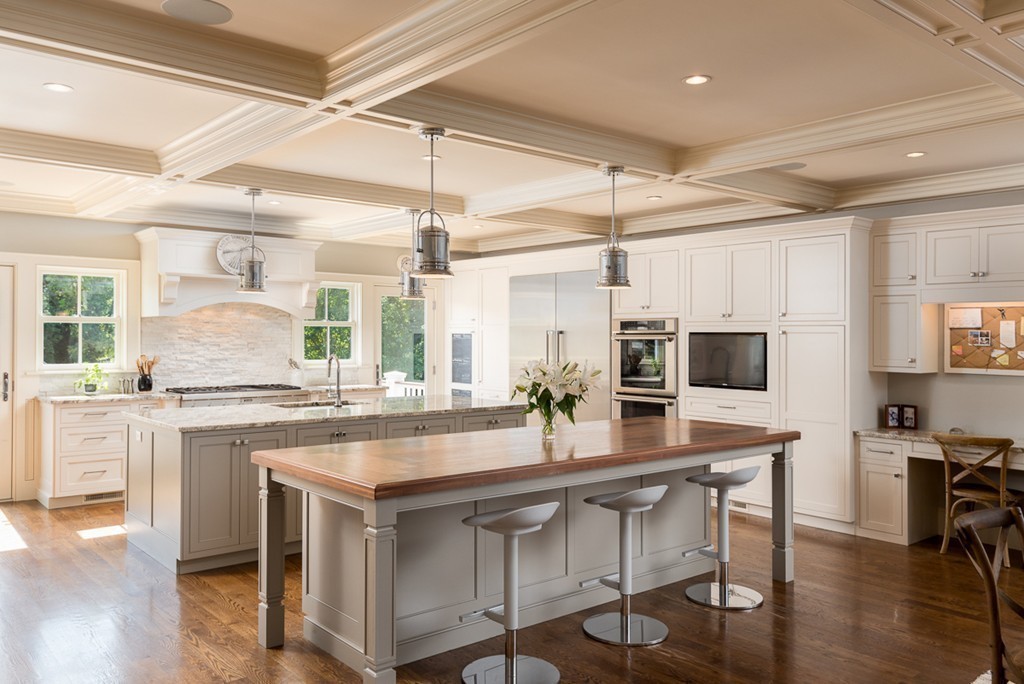 392 Main Street Hingham, MA 02043 - Photo 7 of 30 a kitchen with kitchen island granite countertop a table chairs microwave and cabinets