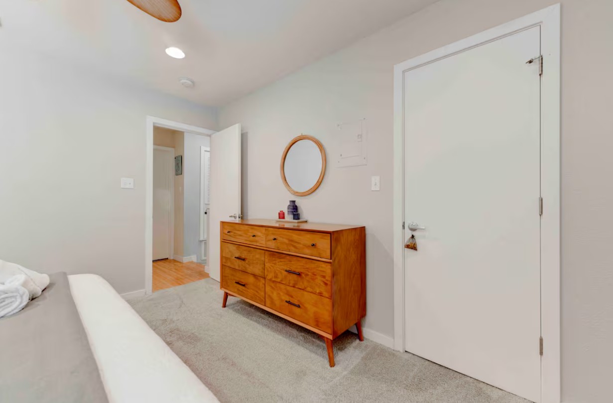 3601 Menchaca Road, Unit 107 Austin, TX 78704 - Photo 11 of 15 a room that has a bed and a mirror