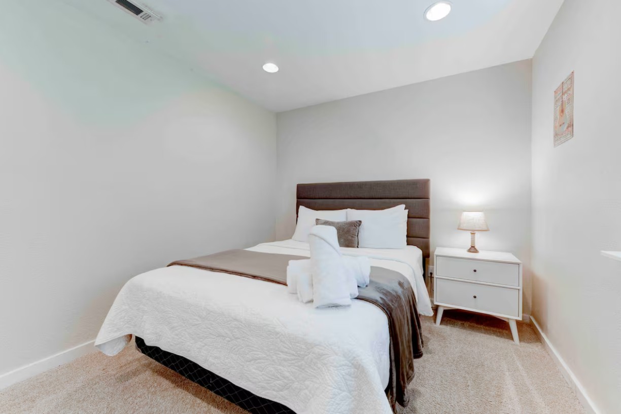 3601 Menchaca Road, Unit 107 Austin, TX 78704 - Photo 12 of 15 a bedroom with a bed and a night stand