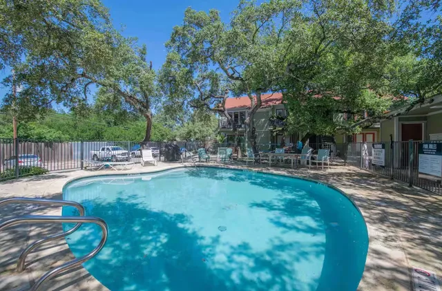 a view of a swimming pool with a patio