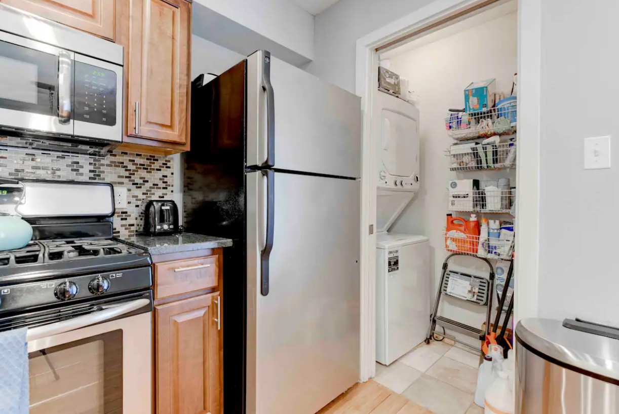 3601 Menchaca Road, Unit 107 Austin, TX 78704 - Photo 5 of 15 a kitchen with stainless steel appliances a refrigerator stove and microwave