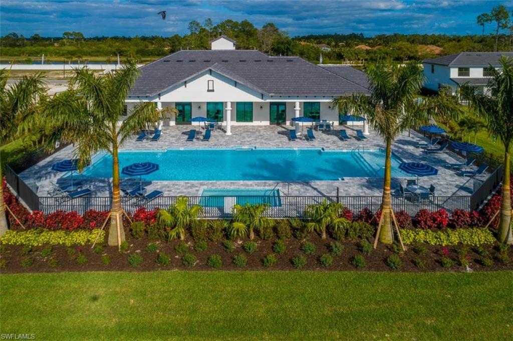 7452 Rockefeller Drive Naples, FL 34119 - Photo 18 of 19 a view of a house with a big yard