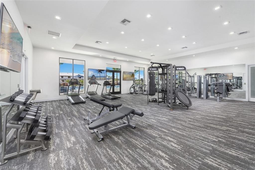 7452 Rockefeller Drive Naples, FL 34119 - Photo 19 of 19 a view of a room with gym equipment