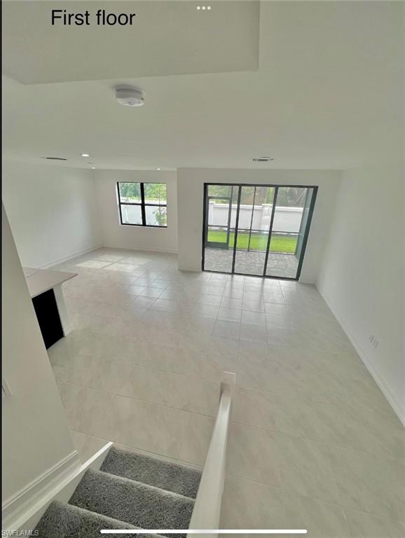 7452 Rockefeller Drive Naples, FL 34119 - Photo 5 of 19 view of room with window and hardwood floor