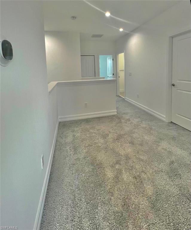 7452 Rockefeller Drive Naples, FL 34119 - Photo 7 of 19 an empty room with windows