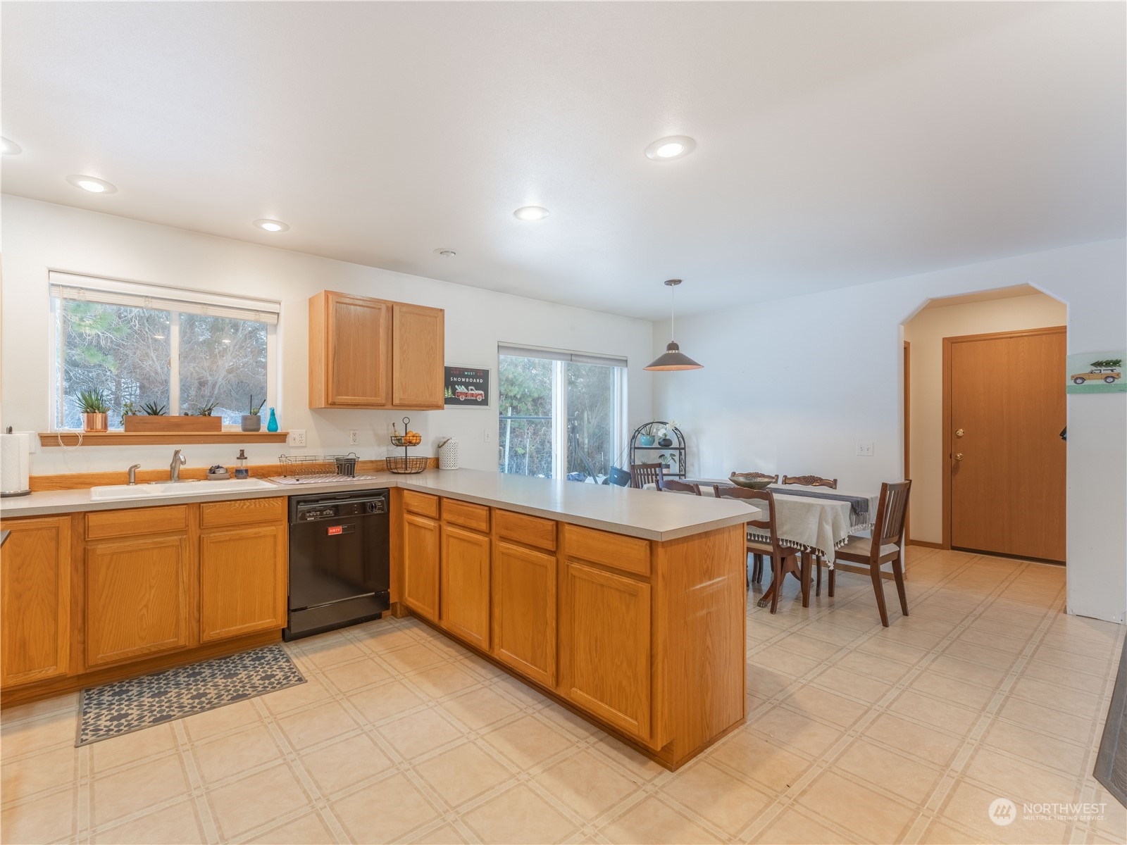 14918 Burkey Street Entiat, WA 98822 - Photo 13 of 39 a large kitchen with kitchen island a sink table and chairs
