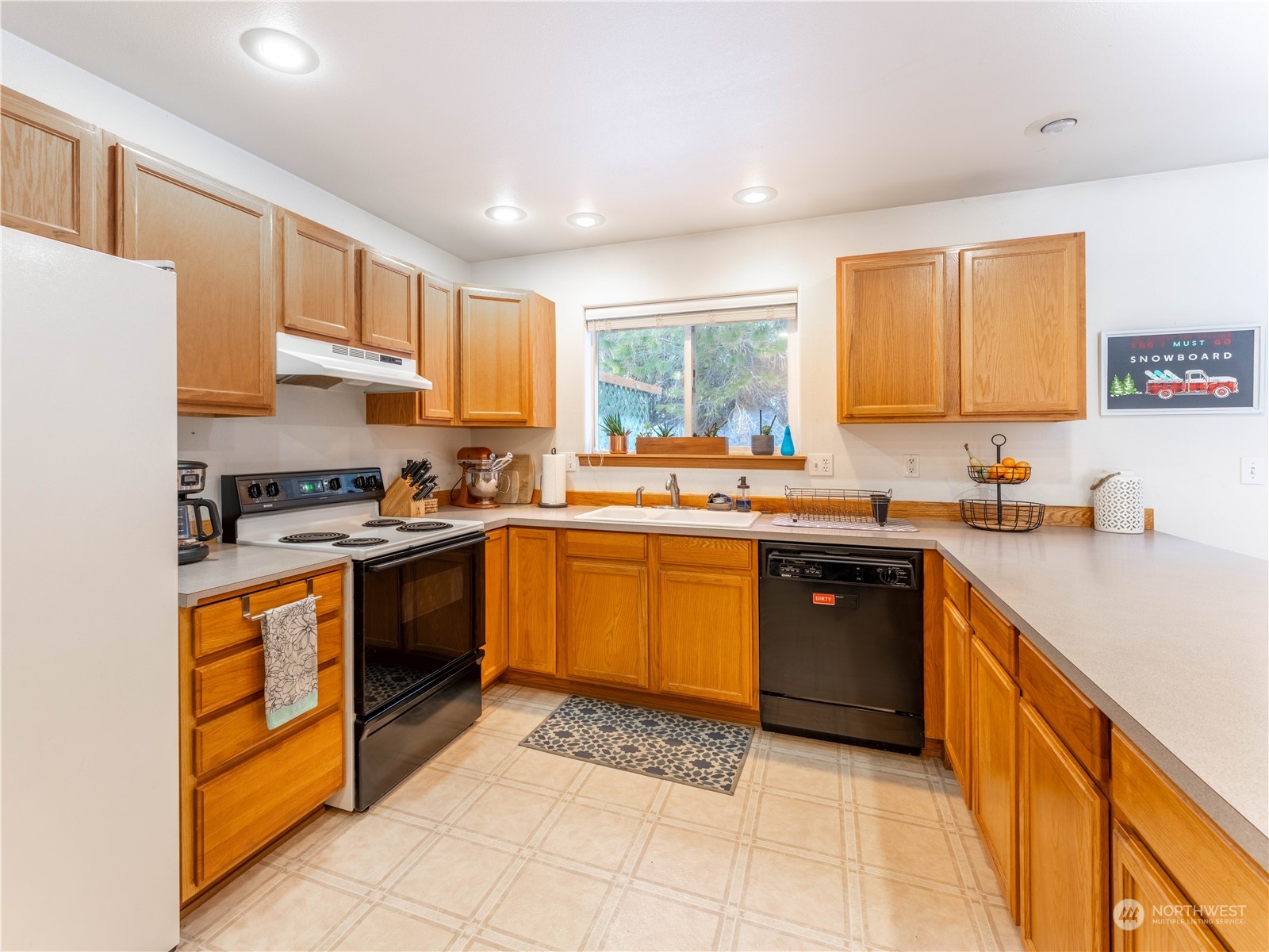 14918 Burkey Street Entiat, WA 98822 - Photo 14 of 39 a kitchen with stainless steel appliances granite countertop a stove sink and cabinets