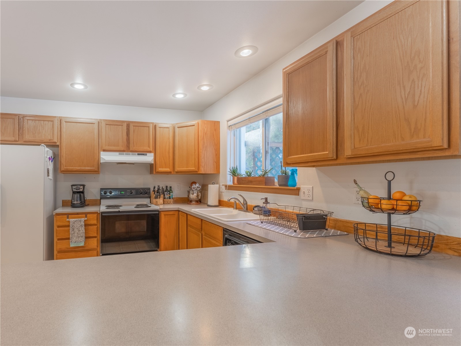 14918 Burkey Street Entiat, WA 98822 - Photo 15 of 39 a kitchen with stainless steel appliances granite countertop a refrigerator sink and stove