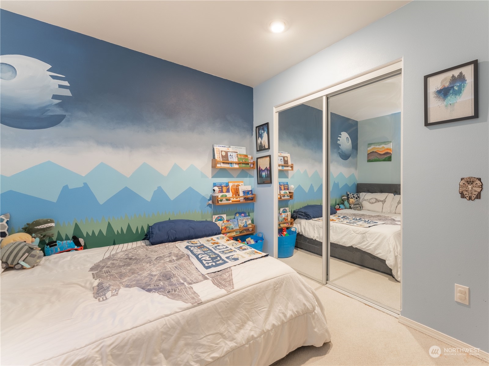 14918 Burkey Street Entiat, WA 98822 - Photo 26 of 39 a bedroom with a large bed and a chandelier
