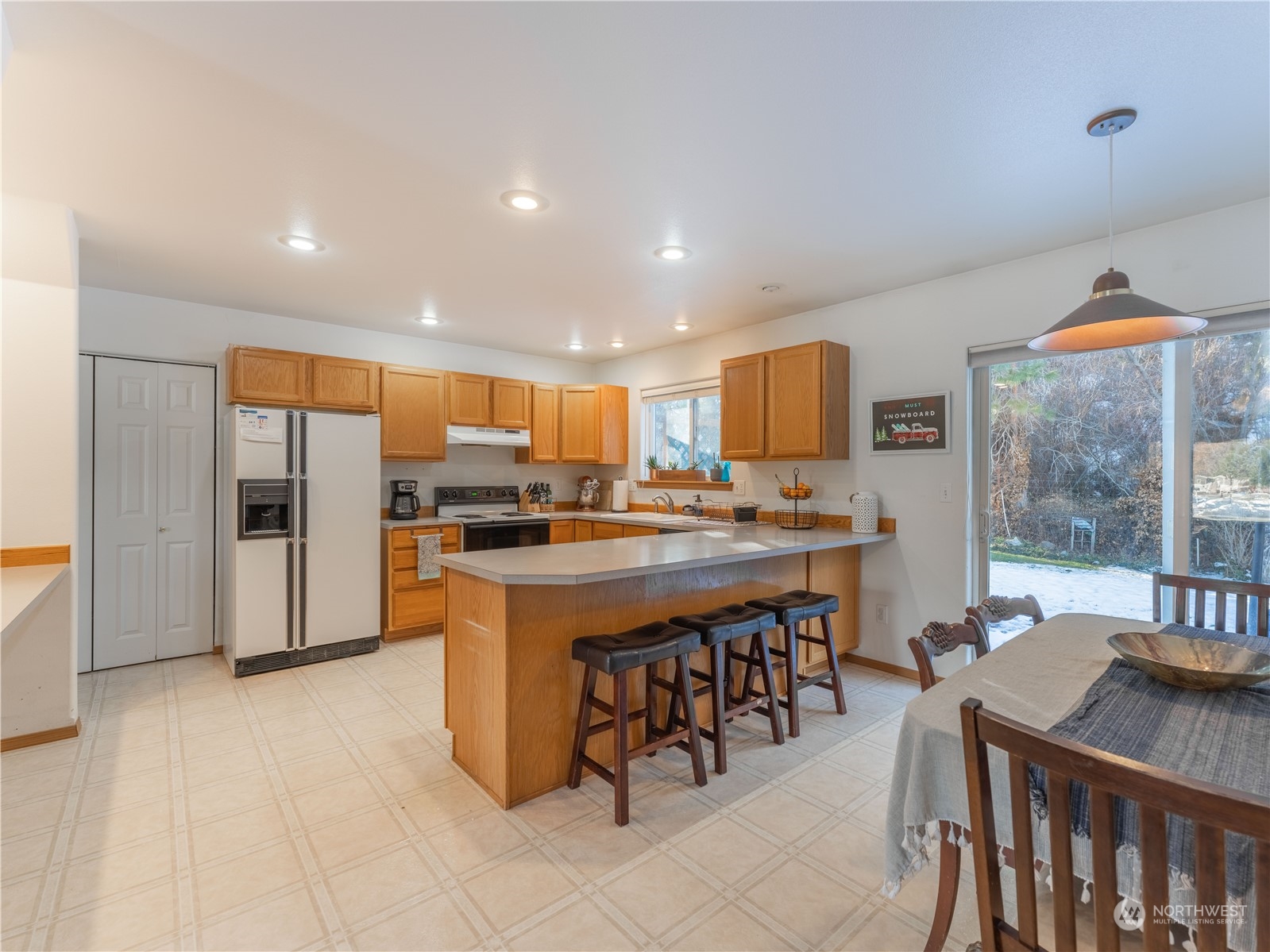 14918 Burkey Street Entiat, WA 98822 - Photo 10 of 39 a kitchen with stainless steel appliances granite countertop a refrigerator a sink a stove and island