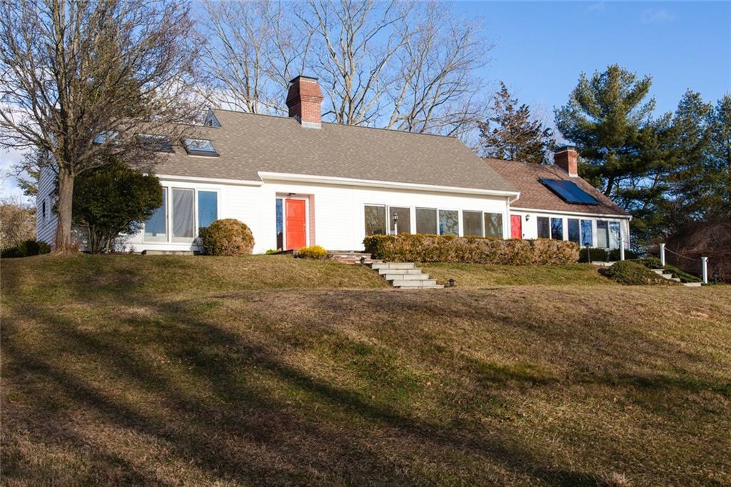 451 Colonial Road Guilford, CT 06437 - Photo 1 of 1 a front view of a house with a yard