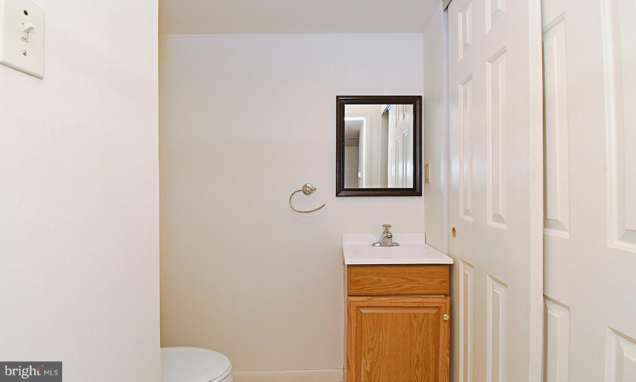 8 Pennington Lane Quakertown, PA 18951 - Photo 12 of 58 a bathroom with a toilet sink and mirror