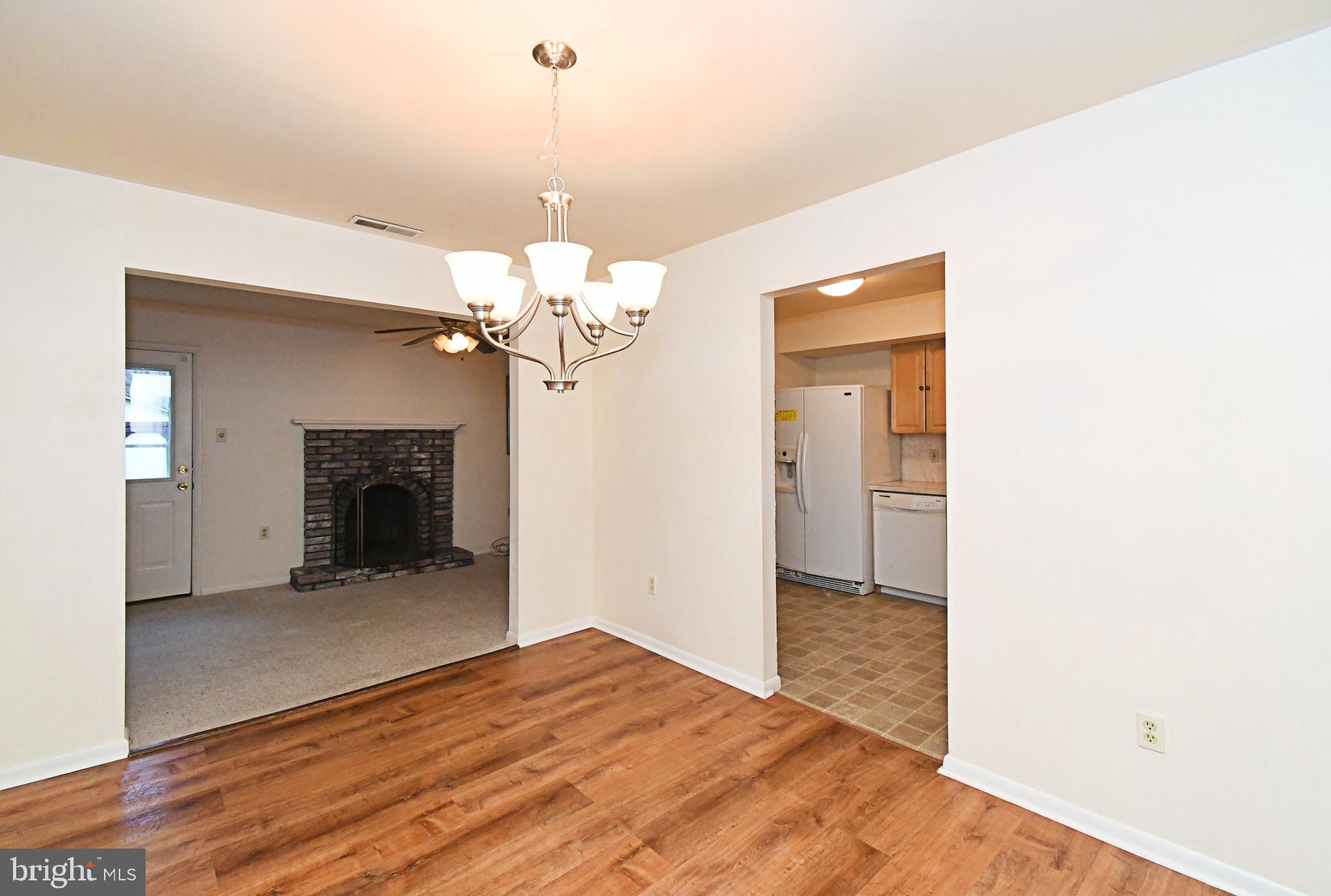 8 Pennington Lane Quakertown, PA 18951 - Photo 13 of 58 a view of a livingroom with a chandelier fan and a kitchen counter space