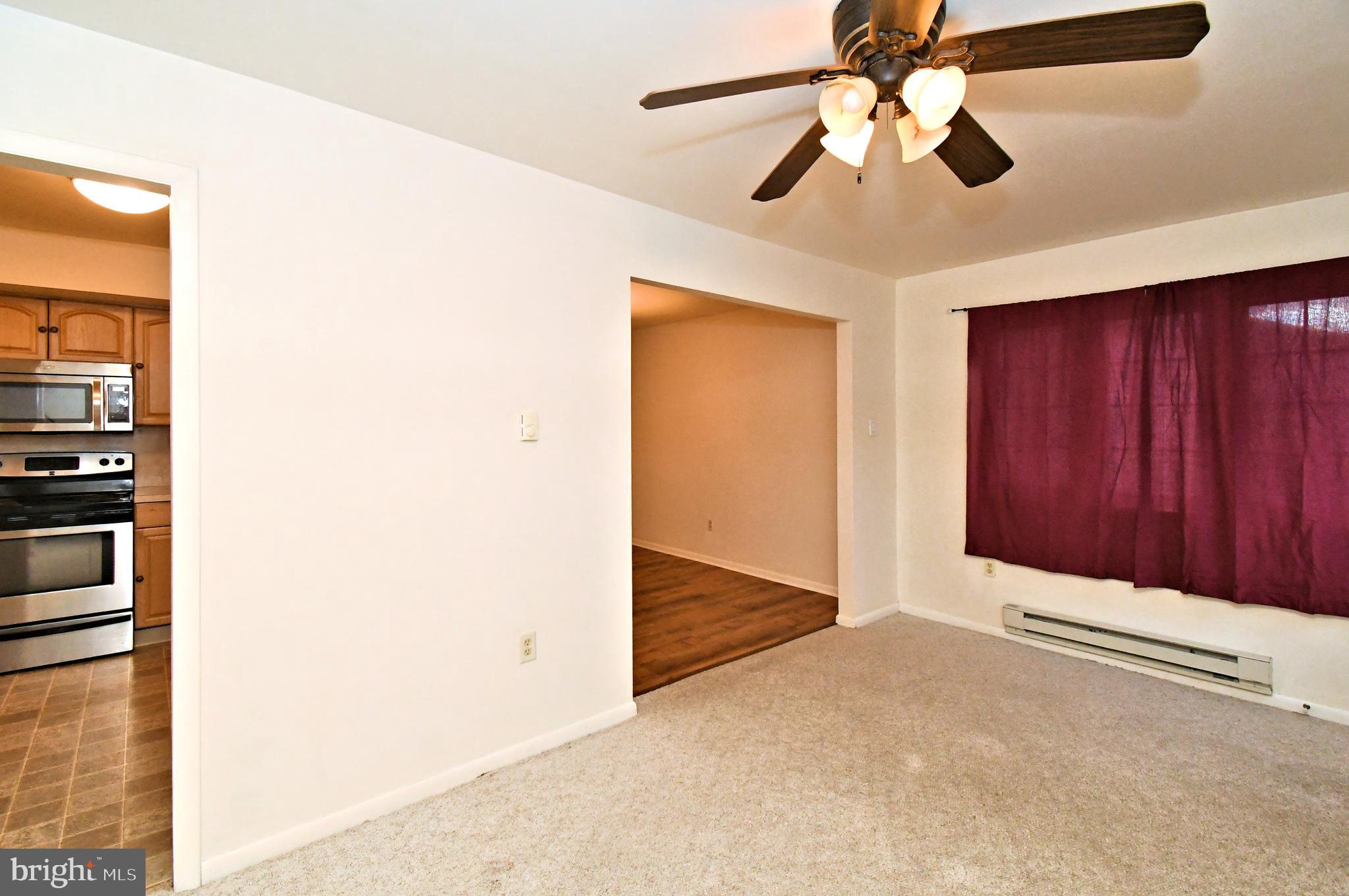 8 Pennington Lane Quakertown, PA 18951 - Photo 24 of 58 a view of a hallway with a chandelier fan