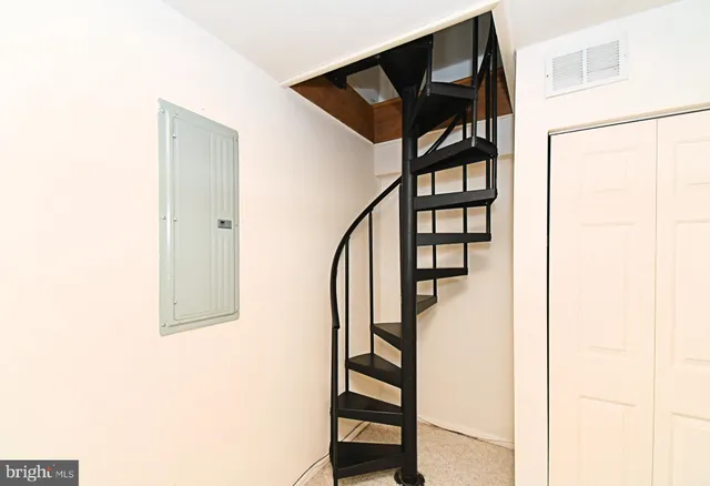 a view of a bathroom from a hallway