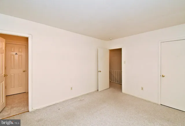 a view of a hallway with a window