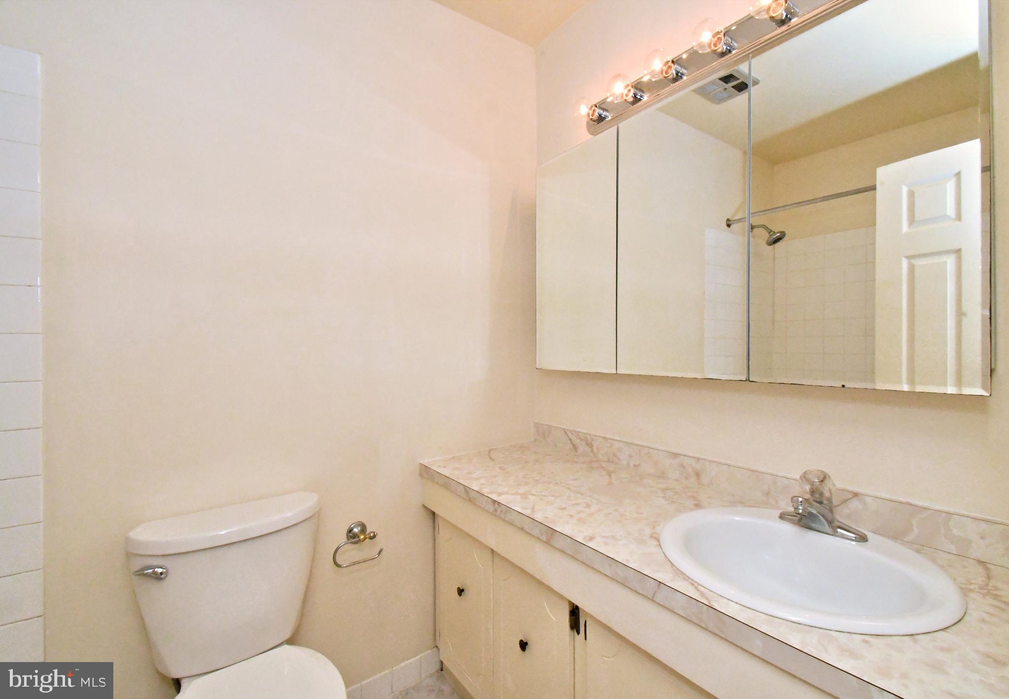8 Pennington Lane Quakertown, PA 18951 - Photo 52 of 58 a bathroom with a granite countertop toilet sink and mirror