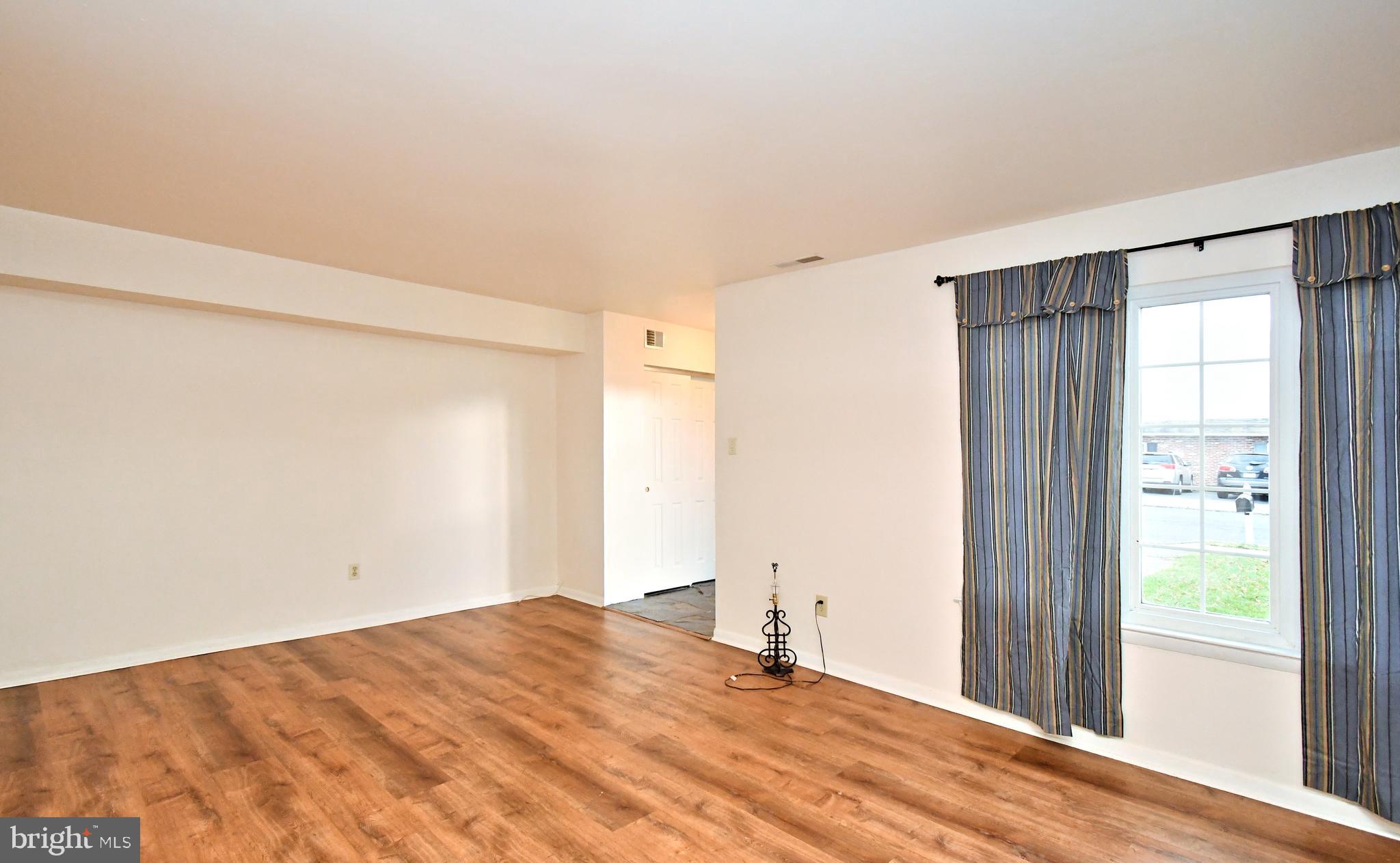 8 Pennington Lane Quakertown, PA 18951 - Photo 9 of 58 a view of empty room with wooden floor and fan