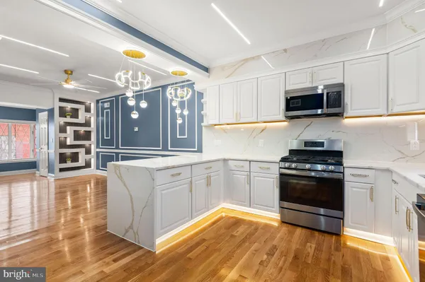 a view of a kitchen with washer and dryer