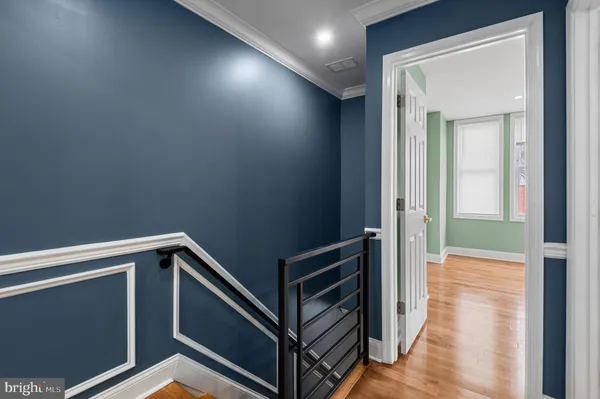 an empty room with closet and wooden floor