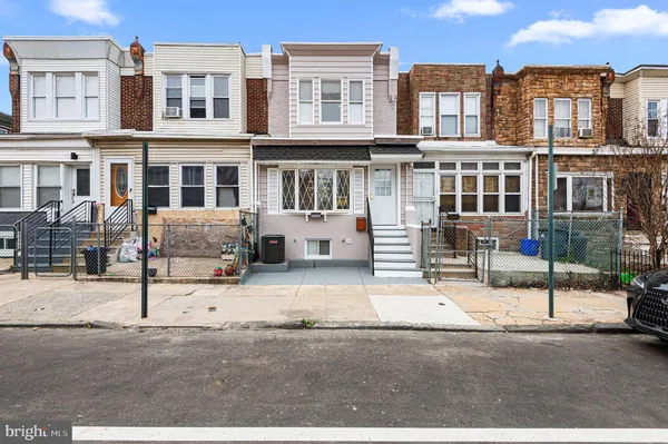 a front view of a building with street view